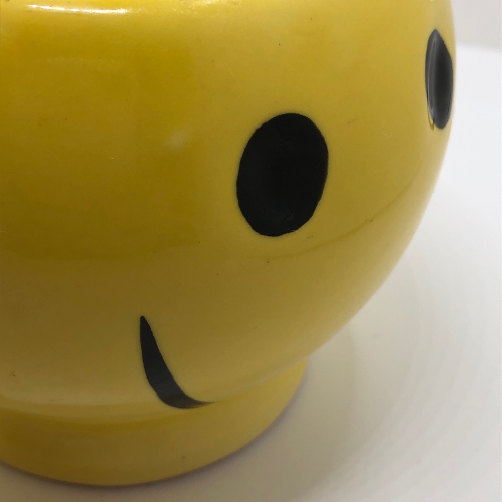 Yellow smiley faced mug
